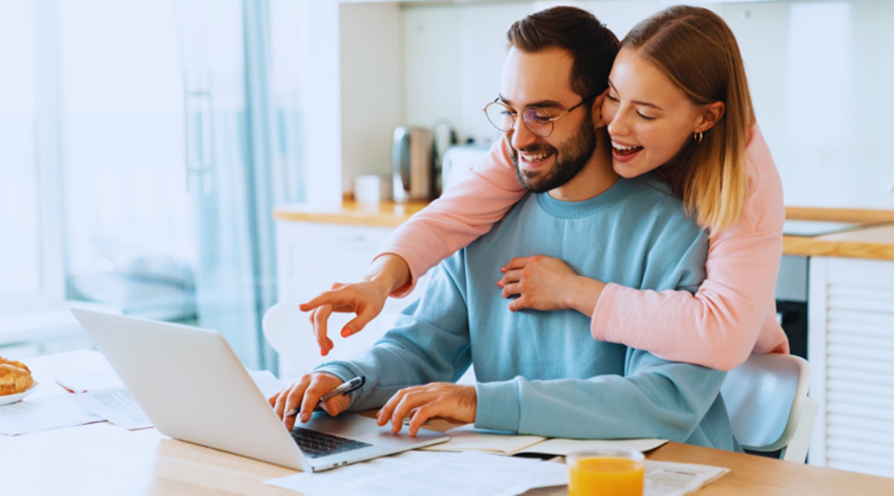 a couple looking at a computer